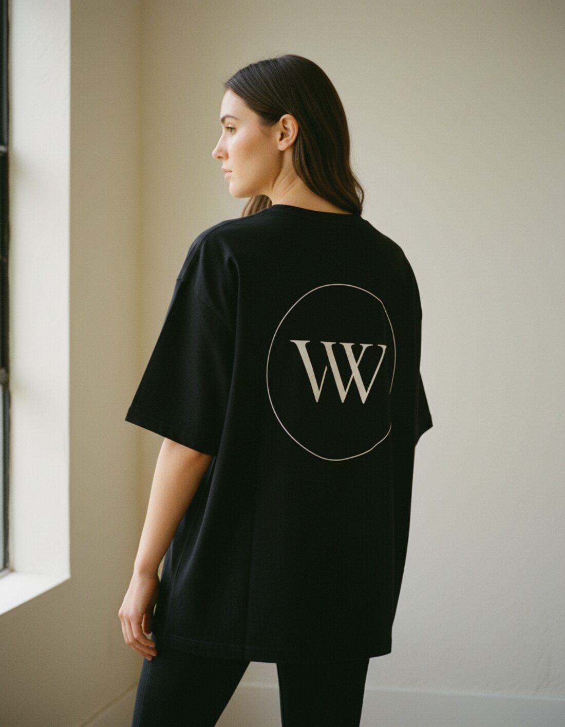 Inaugural Edition Oversized Tee in black, back view with circular VW monogram