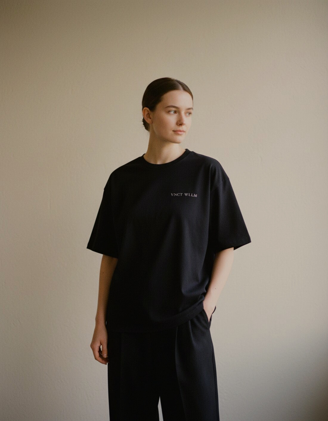 Inaugural Edition Oversized Tee in black, front view with chest wordmark